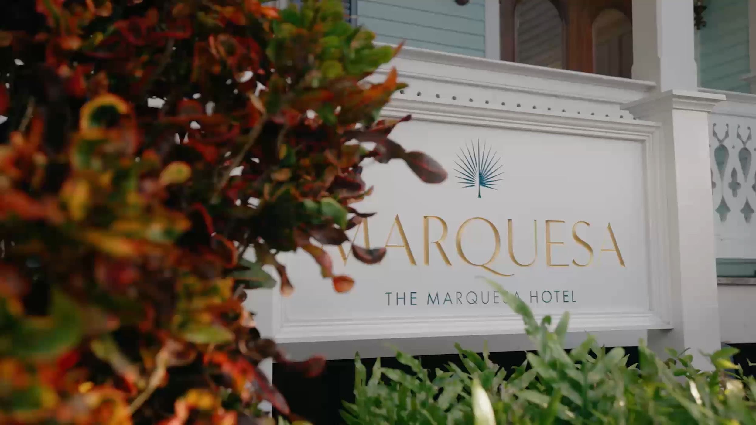 The Marquesa Hotel sign on the front of a white porch